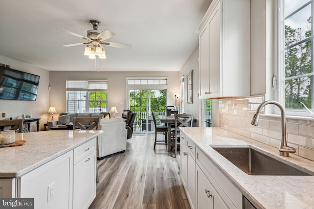 1723 Magnolia Ct, Garnet Valley, PA 19060 - kitchen with a sink, light wood finished floors, ceiling fan, tasteful backsplash, and white cabinetry