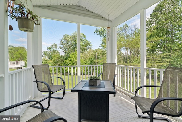 1723 Magnolia Ct, Garnet Valley, PA 19060 - sunroom featuring lofted ceiling, healthy amount of natural light, and view of scattered trees