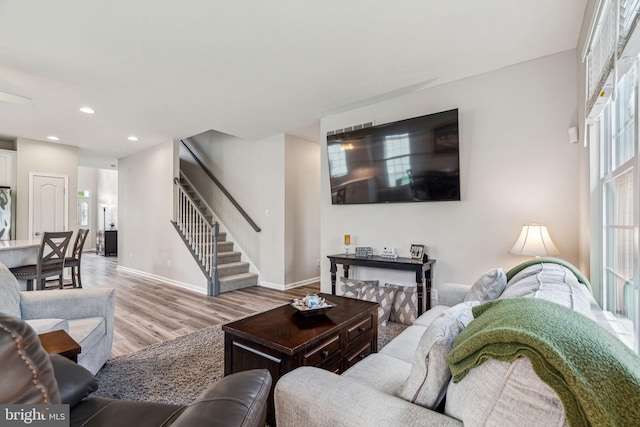 1723 Magnolia Ct, Garnet Valley, PA 19060 - living room with stairs, light wood-style floors, recessed lighting, and baseboards
