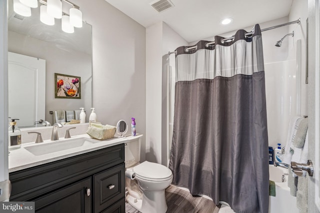 1723 Magnolia Ct, Garnet Valley, PA 19060 - bathroom with toilet, wood finished floors, vanity, and shower / tub combo with curtain