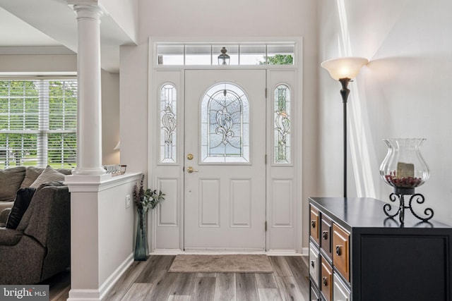 1723 Magnolia Ct, Garnet Valley, PA 19060 - foyer featuring ornate columns, wood finished floors, and healthy amount of natural light