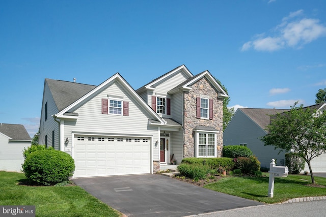 1723 Magnolia Ct, Garnet Valley, PA 19060 - traditional home with stone siding, asphalt driveway, a front yard, and an attached garage