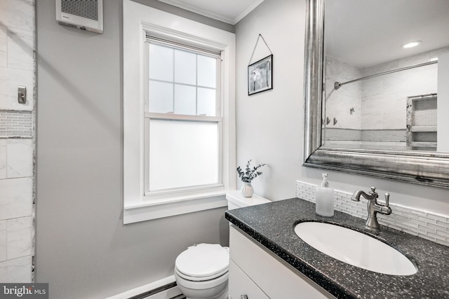bathroom featuring toilet, vanity, tiled shower, ornamental molding, and heating unit