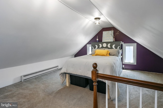 carpeted bedroom featuring a baseboard radiator and vaulted ceiling