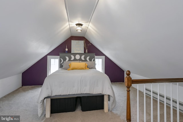 carpeted bedroom featuring vaulted ceiling and a baseboard heating unit