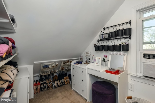 bar area with lofted ceiling and light colored carpet