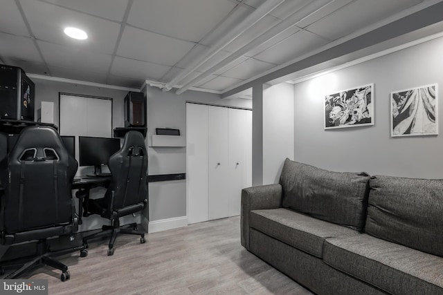 home office with light wood-style floors and baseboards