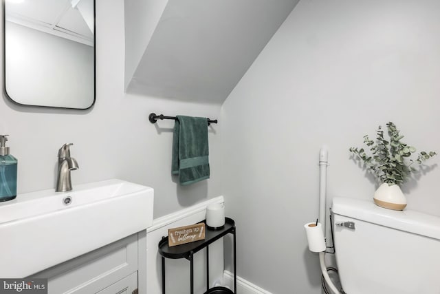 bathroom with toilet and vanity