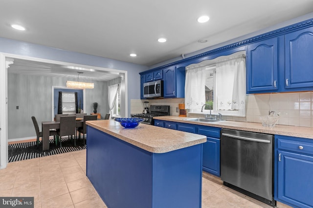 217 Lake Ave, Hamilton, NJ 08610 - kitchen featuring a sink, stainless steel appliances, blue cabinets, light tile patterned flooring, and recessed lighting