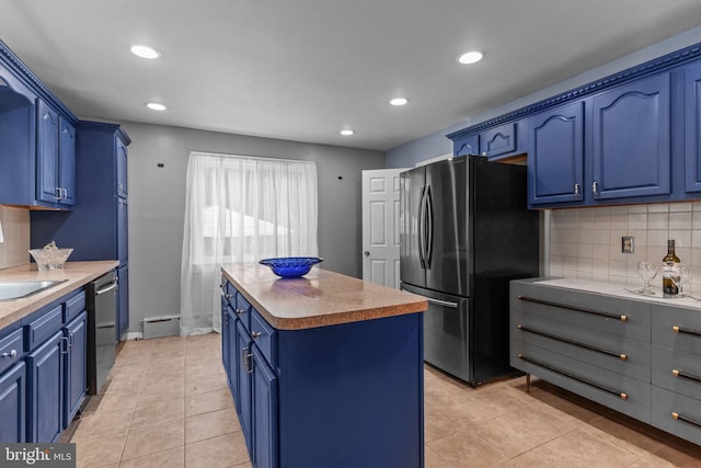 217 Lake Ave, Hamilton, NJ 08610 - kitchen featuring blue cabinets, appliances with stainless steel finishes, a kitchen island, and recessed lighting
