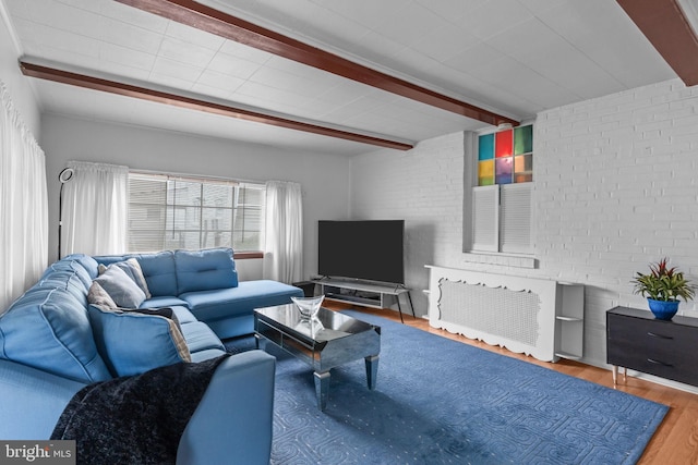 217 Lake Ave, Hamilton, NJ 08610 - living area featuring wood finished floors, beamed ceiling, and brick wall