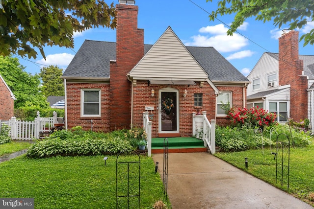 217 Lake Ave, Hamilton, NJ 08610 - view of front of property featuring brick siding, a shingled roof, and a chimney