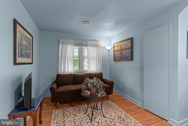 217 Lake Ave, Hamilton, NJ 08610 - living room featuring wood finished floors and baseboards