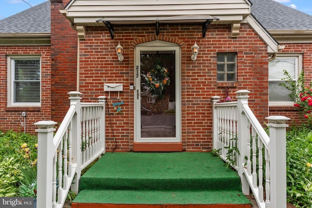 217 Lake Ave, Hamilton, NJ 08610 - doorway to property featuring brick siding and a shingled roof