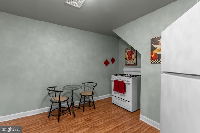 217 Lake Ave, Hamilton, NJ 08610 - kitchen featuring white appliances, wood finished floors, and baseboards