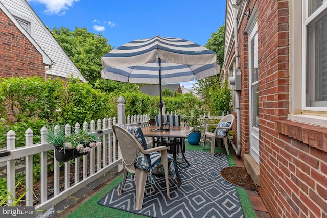 217 Lake Ave, Hamilton, NJ 08610 - view of patio with outdoor dining space and fence