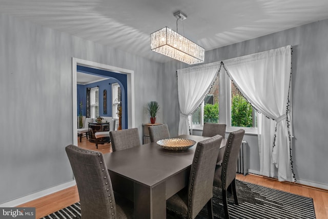 217 Lake Ave, Hamilton, NJ 08610 - dining space with a chandelier, wood finished floors, and baseboards
