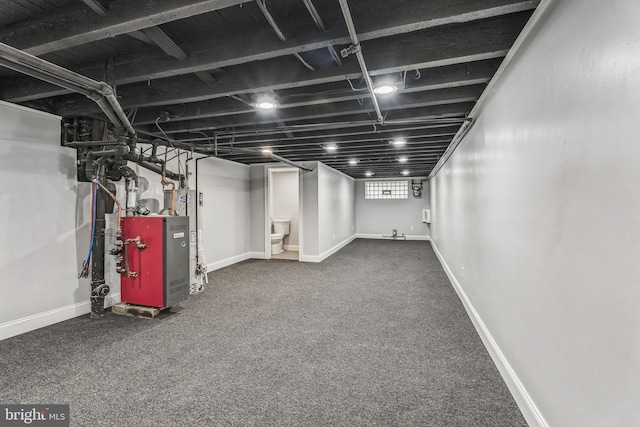 860 Foulkrod St, Philadelphia, PA 19124 - below grade area featuring baseboards, a heating unit, and carpet floors