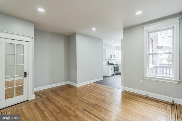 860 Foulkrod St, Philadelphia, PA 19124 - empty room with wood finished floors, baseboards, and recessed lighting