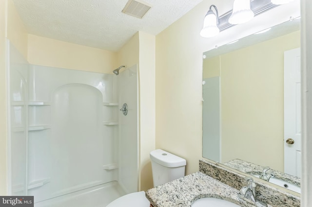 8151 Mandan Ter, Greenbelt, MD 20770 - full bathroom with a shower, toilet, a textured ceiling, and vanity