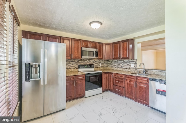 8151 Mandan Ter, Greenbelt, MD 20770 - kitchen with stainless steel appliances, a sink, light marble finish floors, light stone countertops, and backsplash