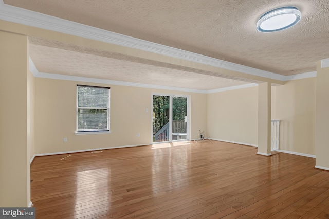 8151 Mandan Ter, Greenbelt, MD 20770 - empty room with wood-type flooring, a textured ceiling, baseboards, and crown molding