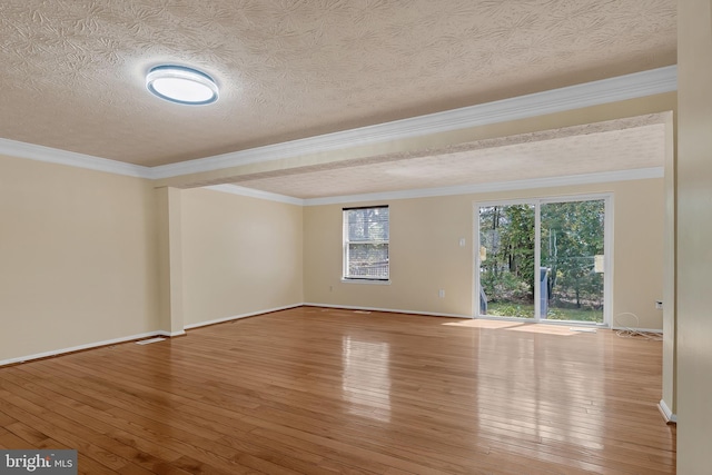 8151 Mandan Ter, Greenbelt, MD 20770 - spare room with wood-type flooring, baseboards, a textured ceiling, and ornamental molding