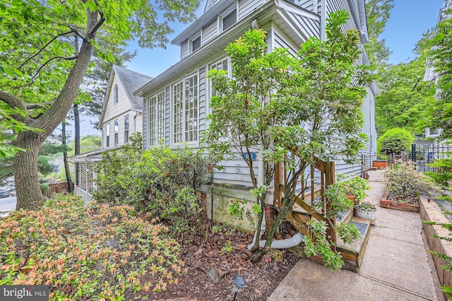 view of property exterior with fence