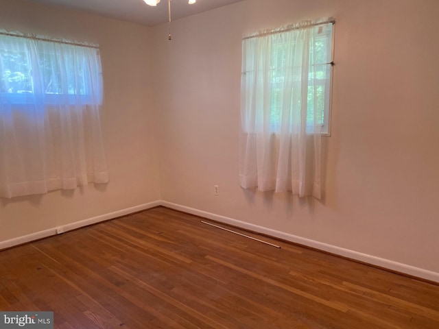 6219 Seminole Pl, Berwyn Heights, MD 20740 - unfurnished room featuring wood-type flooring, baseboards, and healthy amount of natural light