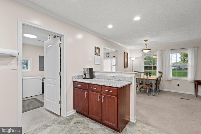 kitchen with ornamental molding, baseboards, a peninsula, light stone counters, and recessed lighting