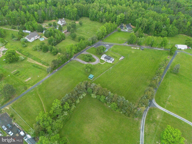 view of rural area featuring a forest