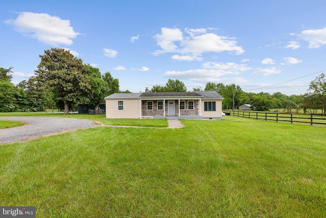 single story home featuring a chimney