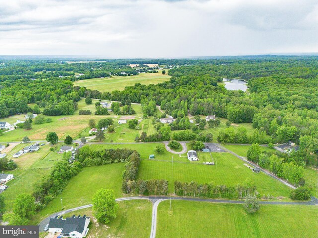 view of rural area featuring a heavily wooded area