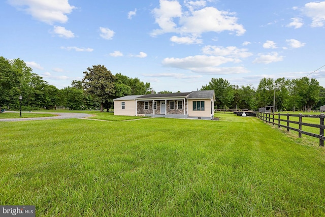 view of front of house with crawl space and gravel driveway