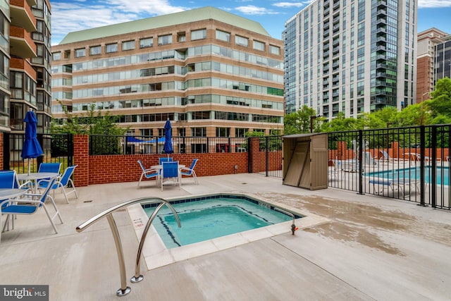 1001 N Randolph St Unit 109, Arlington, VA 22201 - community pool featuring a hot tub, fence, and a patio
