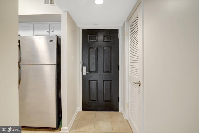 1001 N Randolph St Unit 109, Arlington, VA 22201 - doorway featuring baseboards and light tile patterned flooring