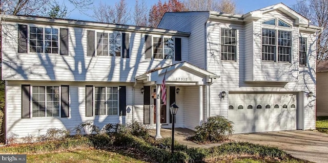 12312 Streamvale Cir, Herndon, VA 20170 - view of front of property with a garage and concrete driveway