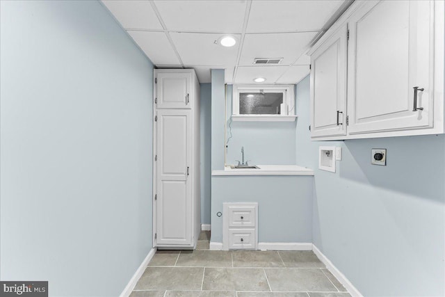 clothes washing area with cabinet space, hookup for an electric dryer, hookup for a washing machine, baseboards, and recessed lighting