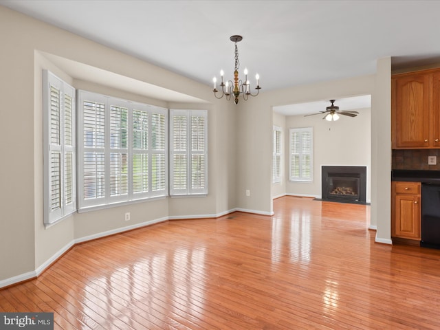 9757 Cheshire Ridge Cir, Manassas, VA 20110 - unfurnished living room with light wood-style flooring, a chandelier, baseboards, a fireplace with flush hearth, and a ceiling fan