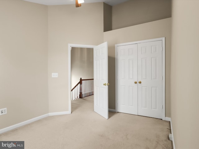 9757 Cheshire Ridge Cir, Manassas, VA 20110 - unfurnished bedroom featuring light carpet, baseboards, and a closet