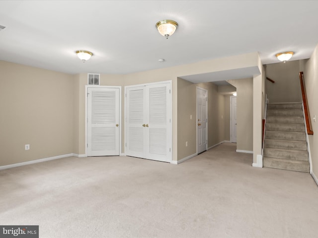 9757 Cheshire Ridge Cir, Manassas, VA 20110 - below grade area with light carpet, baseboards, and stairs