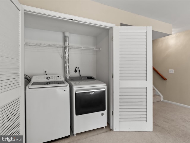 9757 Cheshire Ridge Cir, Manassas, VA 20110 - laundry area with washing machine and dryer, light colored carpet, and baseboards