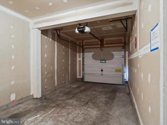 9757 Cheshire Ridge Cir, Manassas, VA 20110 - garage with a garage door opener and baseboards
