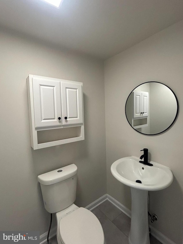 147 W Broad St, Telford, PA 18969 - half bath with baseboards, tile patterned flooring, and toilet