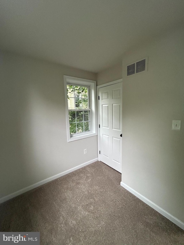 147 W Broad St, Telford, PA 18969 - unfurnished bedroom featuring dark carpet and baseboards