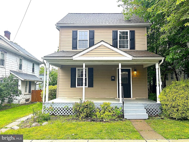 147 W Broad St, Telford, PA 18969 - view of front facade featuring covered porch and a front yard