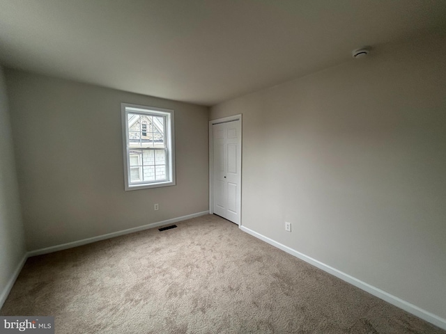 147 W Broad St, Telford, PA 18969 - spare room featuring baseboards, carpet, and a smoke detector