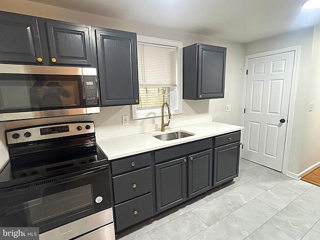 147 W Broad St, Telford, PA 18969 - kitchen with stainless steel appliances, a sink, light countertops, and baseboards