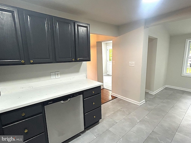 147 W Broad St, Telford, PA 18969 - kitchen featuring dark cabinetry, light countertops, dishwasher, and baseboards