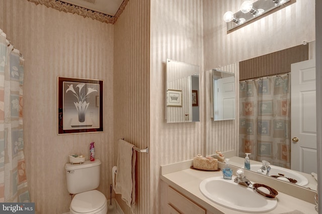 4 Montclair Ave, Berlin, NJ 08009 - bathroom featuring wallpapered walls, toilet, and vanity